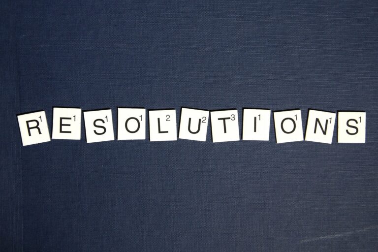 The word "resolution" spelled out in word tile pieces
